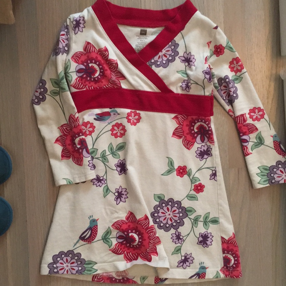 Adorable cream dress with birds and flowers.